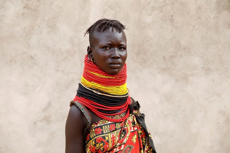 A young Turkana woman poses for a picture in the village of Lorengippi near the town of Lodwar, Turkana county, Kenya. REUTERS/Baz Ratner